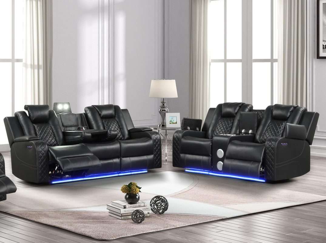Benz Black Leather Reclining Sofa Set: The Ultimate in Modern Comfort Elevate Your Living Room with Our Power Recliner Black Leather Sofa The Benz Black Leather Reclining Sofa Set redefines relaxation with its ultra-cool, contemporary design. This modern black leather sofa combines cutting-edge technology with luxurious comfort, making it the perfect centerpiece for any modern living space. Key Features of Our Black Leather Reclining Sofa Set: Fabulous faux leather upholstery with pebbled effect One-touch power control with adjustable headrest Unique LED lights for ambient illumination Love seat with built-in console and Bluetooth speaker Sofa with central reading light and convenient cupholders High-quality, durable solid wood construction Advanced Technology for Ultimate Relaxation This modern black sofa with LED lights offers more than just comfort. The one-touch power control allows effortless adjustment of reclining positions, while the adjustable headrest ensures perfect neck and head support. Entertainment at Your Fingertips The love seat's built-in console and Bluetooth speaker bring entertainment to your fingertips. Enjoy your favorite music or keep your essentials close at hand while you relax. Thoughtful Design for Modern Living The Benz set isn't just about comfort; it's designed for modern lifestyles. The black leather sofa with power headrest features a central reading light for late-night reading without disturbing others, while convenient cupholders keep your drinks within reach. Ambient Lighting for the Perfect Mood Create the perfect atmosphere with unique LED lights located at the bottom of each piece, adding a touch of modernity and elegance to your space. Durable Construction for Lasting Enjoyment Crafted with solid wood material, this modern sofa with phone charger ensures durability and longevity. Its high-quality construction guarantees years of comfort and style. Experience the perfect blend of technology and comfort with the Benz Black Leather Reclining Sofa Set. Its striking design and advanced features make it an ideal choice for those seeking a modern, luxurious living room experience. Looking for more options? Check out our selection of reclining sofa sets to find the perfect match for your home. Transform your living room into a haven of comfort and style with the Benz Black Leather Reclining Sofa Set. Embrace the future of relaxation with this exceptional power recliner black leather 2 pc sofa and loveseat