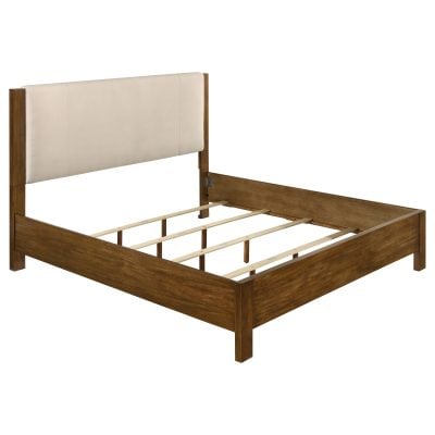 Adderley eastern king wood panel bed with cream fabric headboard, three-quarter angle view