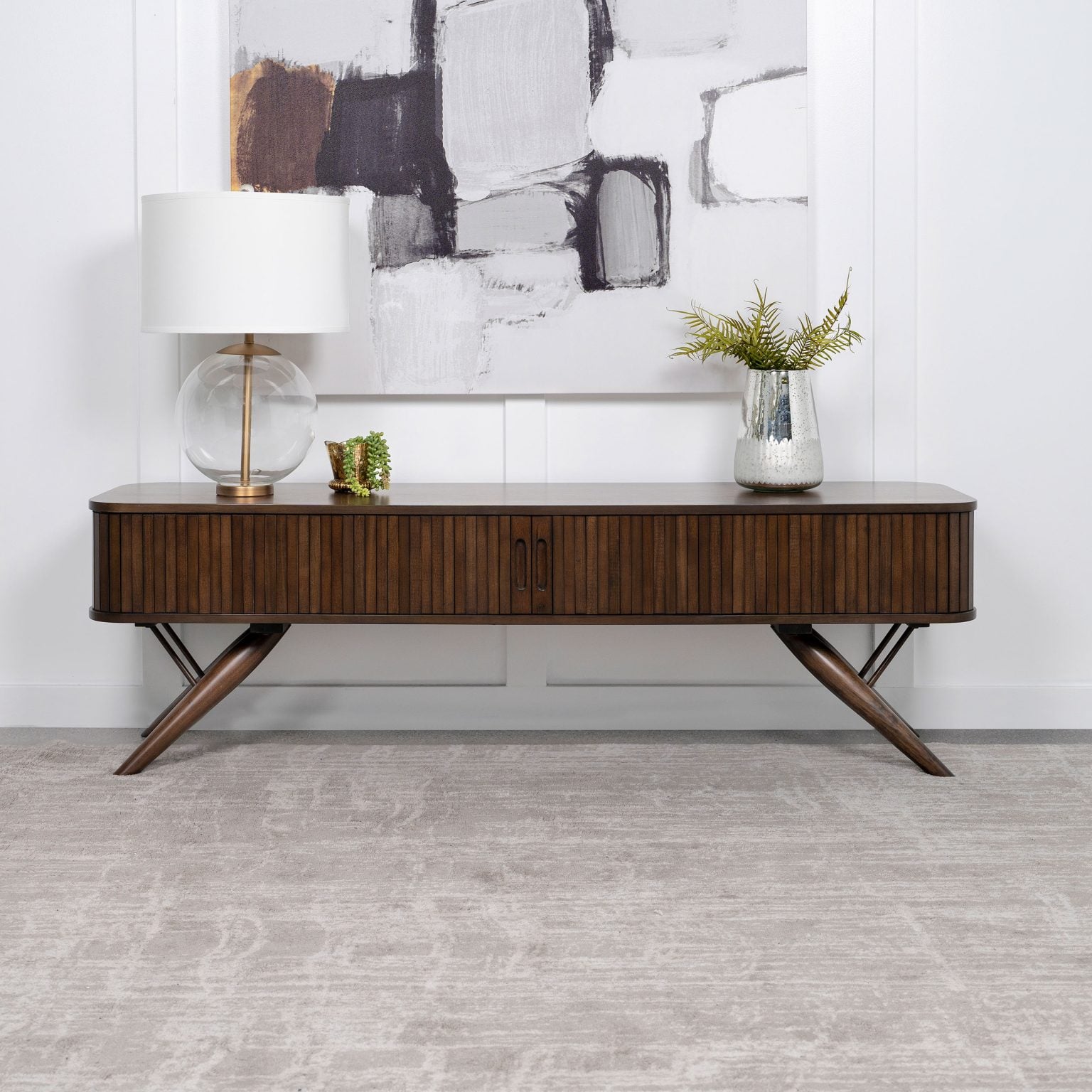 Valna 71-inch TV stand in walnut wood, three-quarter angle view