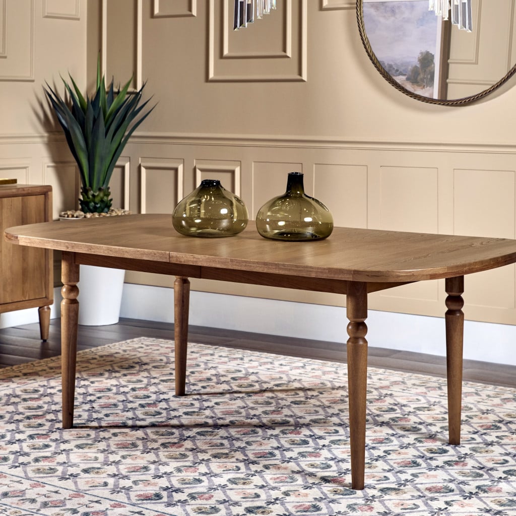 Front view of Langley extension dining table in Cabin Glow wood