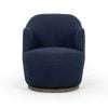 Front view of the Aurora swivel chair in Copenhagen Indigo deep blue | Three-quarter view of the Aurora drum chair showing the 360 swivel base | Side profile of the Aurora accent chair, 31 inches tall | Room scene with the Aurora swivel chair in a living room corner | Close-up of the Copenhagen Indigo upholstery texture | Rear view of the Aurora swivel chair | Detail of the indigo weave in natural light | Close-up of the swivel mechanism and base | Detail of the Aurora's tailored drum silhouette