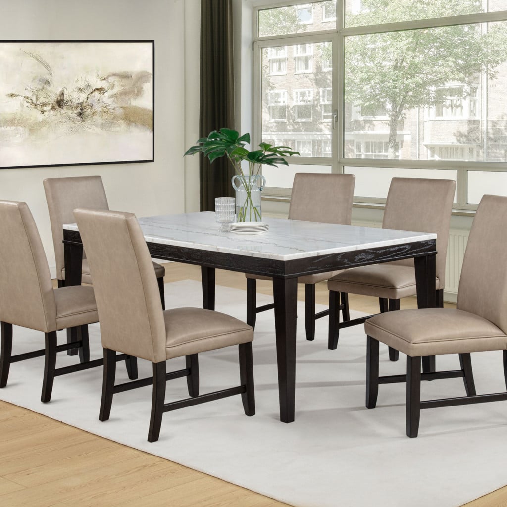 Averill 7-piece white marble top dining set in tan and coffee bean, front view | Averill dining set, three-quarter angle view | Averill 72-inch white marble dining table, table only view | Averill dining set tan upholstered side chairs, chair detail | Averill set white marble tabletop veining, close-up | Averill dining chair tall backrest in tan faux leather, close-up | Averill set coffee bean tapered table legs, detail view | Averill 7-piece dining set, side angle view | Averill marble dining table, top-down view with chairs | Averill dining chair padded seat and back profile | Averill set table edge and apron detail, close-up | Averill tan chair upholstery texture, close-up | Averill 7-piece set styled in a bright dining room | Averill dining table with six tan chairs, wide room view | Averill chair leg and seat joinery detail | Averill white marble top dining set in tan, lifestyle scene