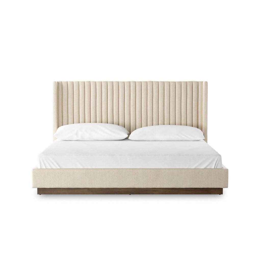 Front view of the Montgomery king bed with tall vertical-channeled headboard in Thames Cream | Three-quarter view of the Montgomery bed showing the floating headboard over plinth base | Side profile of the Montgomery king bed highlighting the channel tufting | Room scene with the Montgomery cream channeled bed in a styled bedroom | Close-up of the vertical channeling texture in Thames Cream performance fabric | Rear view of the Montgomery king bed | Detail of the Montgomery's channeled headboard upholstery | Close-up of the solid parawood plinth base | Detail of the channel seams and tailored finish | Top-down view of the Montgomery bed showing proportions | Close-up of the Thames Cream weave in natural light | Detail view of the headboard-to-base transition