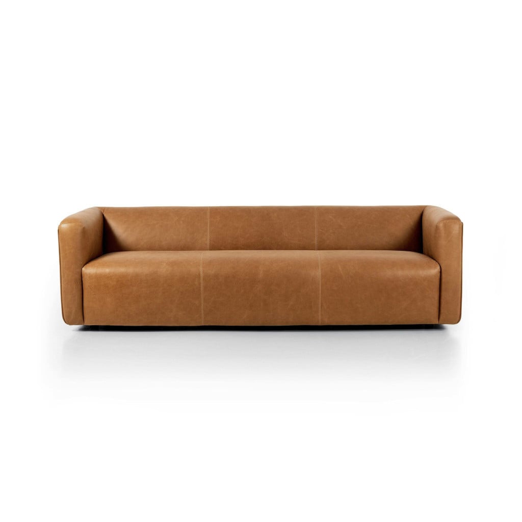 Front view of the Wellborn 97-inch sofa in Palermo Cognac thick-cut top-grain leather | Three-quarter view of the Wellborn cognac leather sofa showing the 1970s low profile | Side profile of the Wellborn leather sofa highlighting the structured frame | Room scene with the Wellborn cognac leather sofa in a styled living room | Close-up of the Palermo Cognac warm brown leather grain and tonal variation | Rear view of the Wellborn 97-inch top-grain leather sofa | Detail of the Wellborn's subtly distressed leather finish | Close-up of the Wellborn's cushion plushness and seam work | Detail of the leather burnishing on the Wellborn's arm | Close-up of the Wellborn's seat cushions in Palermo Cognac | Detail of the Wellborn's 1970s-inspired leg and base | Close-up of the thick-cut leather edge on the Wellborn | Detail of natural creasing in the Wellborn's top-grain leather | Close-up of the Palermo Cognac color depth in natural light | Detail view of the Wellborn's back cushions and tailored finish