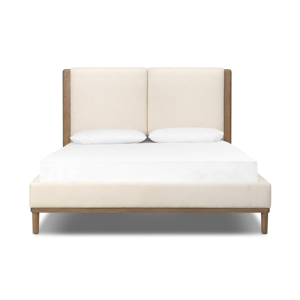 Front view of the Ettie queen bed with oak veneer headboard and bone-white upholstered panels | Three-quarter view of the Ettie bed showing the mixed-material headboard design | Side profile of the Ettie queen bed with 48-inch headboard | Room scene with the Ettie mid-century bed in a Scandinavian bedroom | Close-up of the Laughlin Bone upholstered panels with blind-pull detailing | Rear view of the Ettie queen bed | Detail of the oak veneer grain on the Ettie headboard | Close-up of the bone-white upholstery texture | Detail of the oak-to-upholstery transition on the headboard | Close-up of the Ettie's solid oak frame craftsmanship