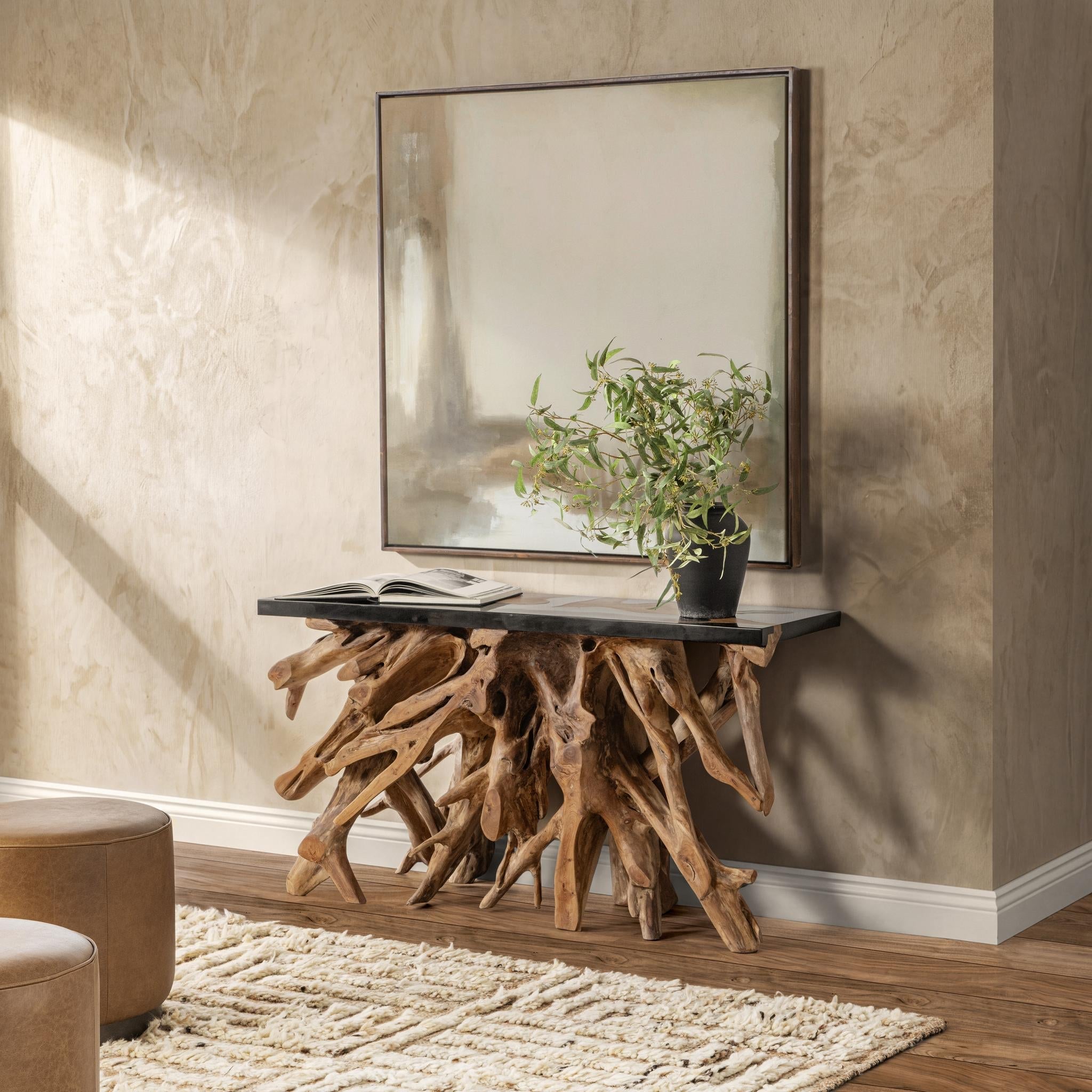 Solana console table in Black Resin with teak root base by Classic Home styled in a room, lifestyle view
