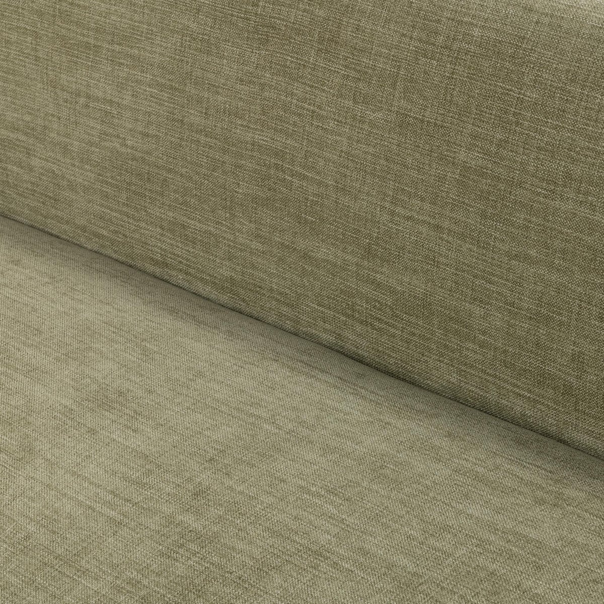 Myra barrel sofa in sage dust green polyester, sculpted solid oak base detail