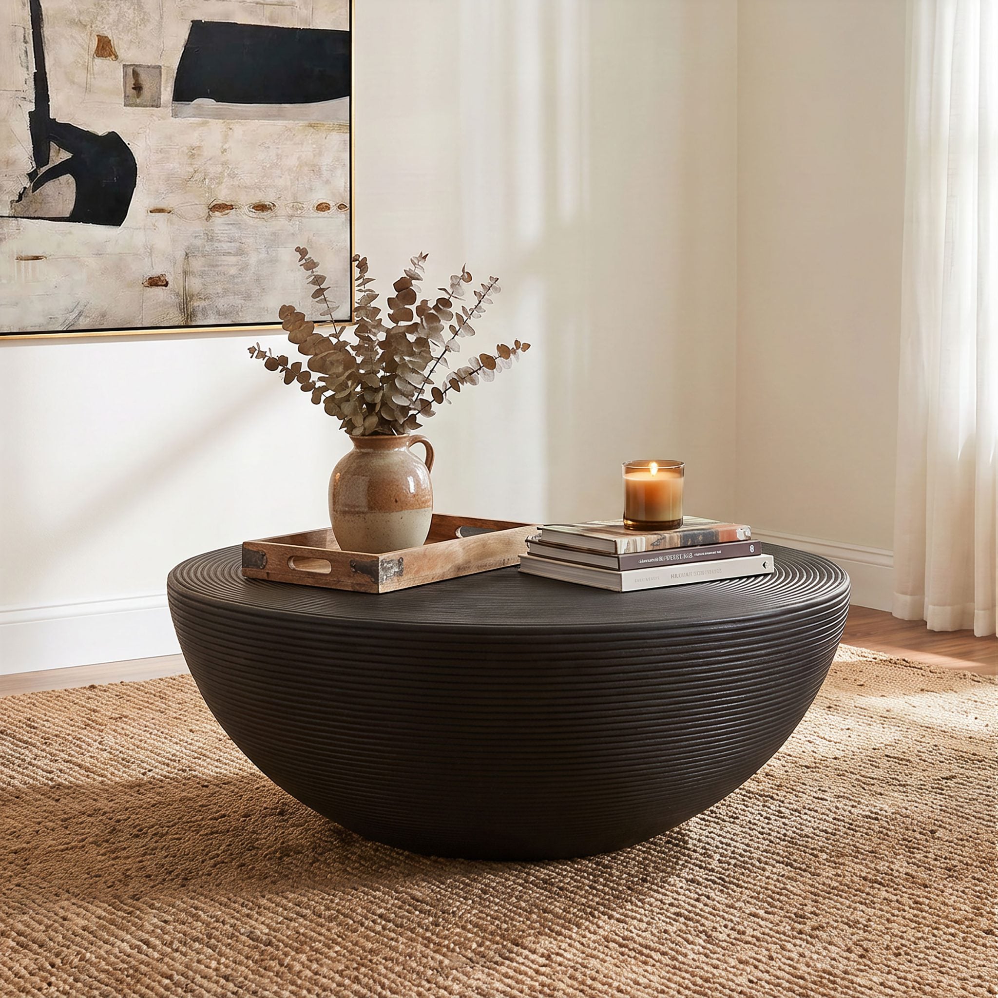 Macedo round ribbed rattan drum coffee table in black rattan, front view