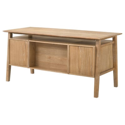 Goodson 64-inch computer desk in distressed light brown wood, styled in a home office