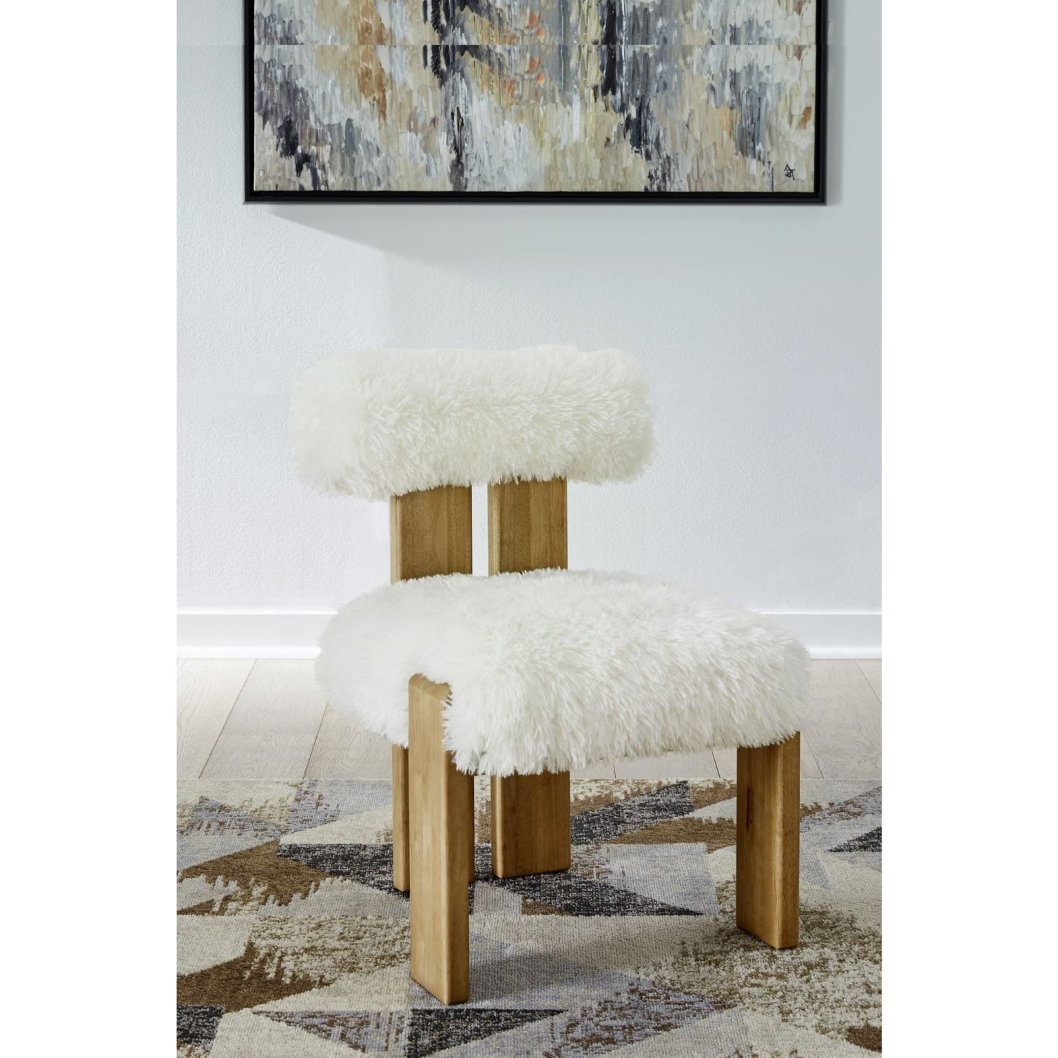 modern sheepskin accent dining chair in Sheepskin and Lioness, Nia front view | Nia dining accent chair in Sheepskin, angled view showing Lioness finish legs
