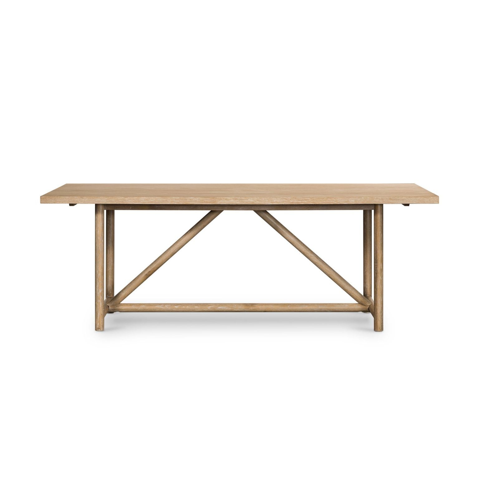 Front view of the Mika 84-inch trestle dining table in whitewashed oak | Three-quarter view showing the triangular stretcher detail | Side profile of the Mika table highlighting the trestle base | Room scene with the Mika table in a bright dining room | Close-up of the triangular stretcher joinery | Detail of the whitewashed oak grain texture | Close-up of the frame-and-panel tabletop construction