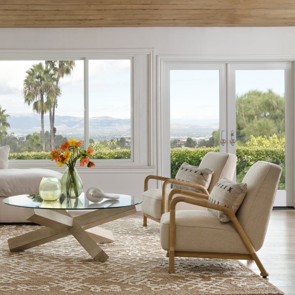 Clyde ivory boucle rattan occasional chair styled in a living room