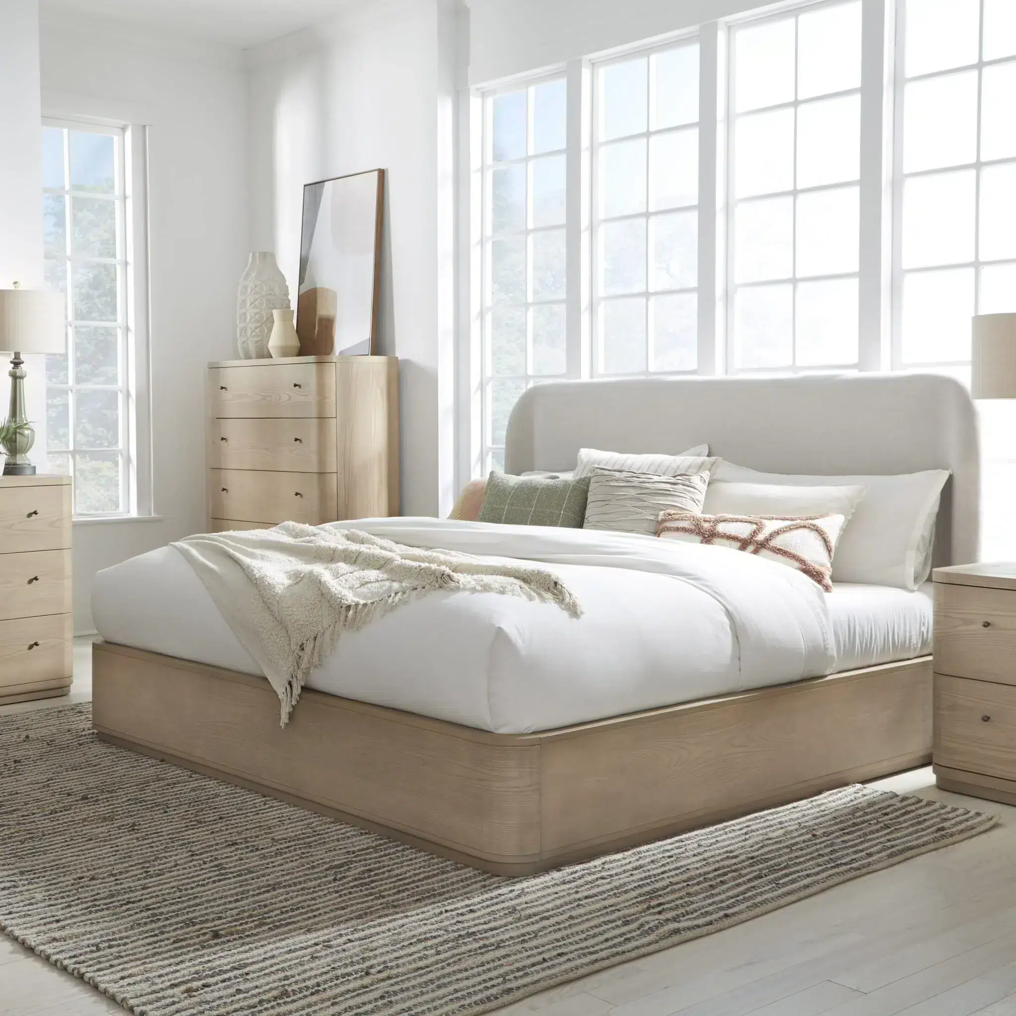 Light wood and linen bed with matching chest and nightstand